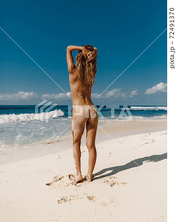 357px x 450px - Naked woman at tropical ocean beach. Slim model... - Stock Photo [72491370]  - PIXTA