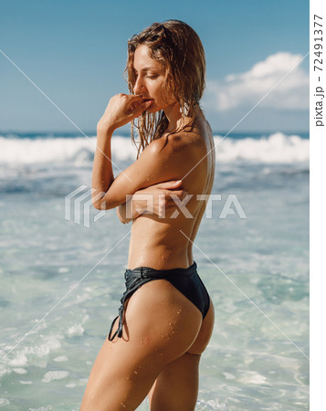 357px x 450px - Naked woman at tropical ocean beach. Slim model... - Stock Photo [72491377]  - PIXTA