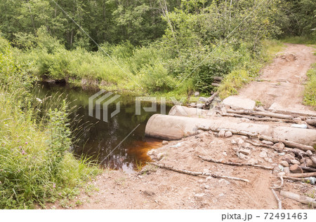 Empty damaged rural road with old bridge, off-road Empty damaged rural road with old bridge, off-road 72491463