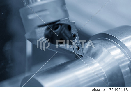 Close-up scene CNC lathe machine thread cutting the metal shaft part. Close-up scene CNC lathe machine thread cutting the metal shaft part. 72492118