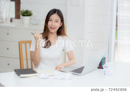 Young asian woman confident working at home with laptop computer and thinking idea for planning. Young asian woman confident working at home with laptop computer and thinking idea for planning. 72492806