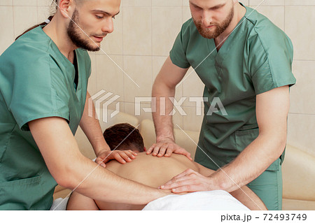 Back massage on back of man. Back massage on back of man. 72493749