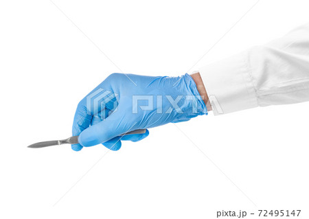 Scalpel in doctor hand 72495147