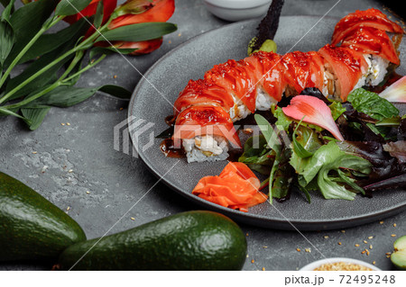 Japanese sushi -red dragon. Avocado, salmon and sushi cheese. Top view Japanese sushi -red dragon. Avocado, salmon and sushi cheese. Top view 72495248