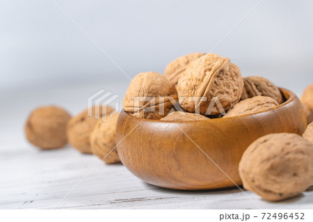 Walnuts kernels on white wooden desk, stock photo Walnuts kernels on white wooden desk, stock photo 72496452