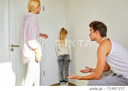 kid girl is in the corner of the room while parents arguing kid girl is in the corner of the room while parents arguing 72497157