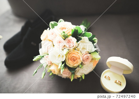 Two golden wedding rings isolated background concept 72497240