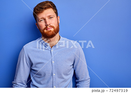 young man in shirt posing at camera isolated young man in shirt posing at camera isolated 72497319