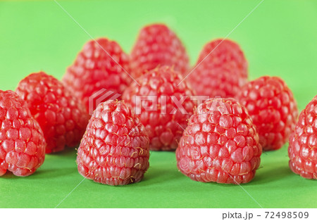 Raspberries on a colored background Raspberries on a colored background 72498509