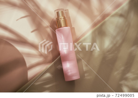 Pink cosmetic beauty bottle minimalist flatlay Pink cosmetic beauty bottle minimalist flatlay 72499005