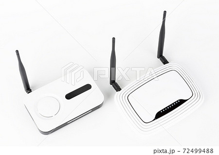 Two wifi routers, wireless devices with one and two antennas on white background. 72499488