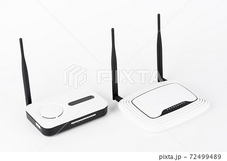 Two wifi routers, wireless devices with one and two antennas on white background. 72499489