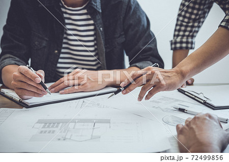 Architecture Engineer Teamwork Meeting, Drawing and working for architectural project and engineering tools on workplace, concept of worksite on technical drawing structure and construction 72499856