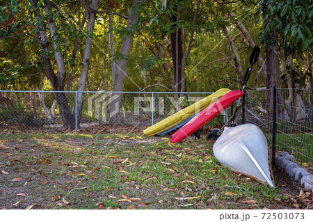 Kayaks Leaning On A Fence 72503073