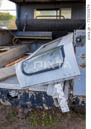 Rubbish In The Back Of An Old Rusting Car 72503074