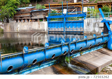 blue metal dam on a small river in the village blue metal dam on a small river in the village 72503262