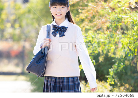 通学する制服の女子中学生の写真素材