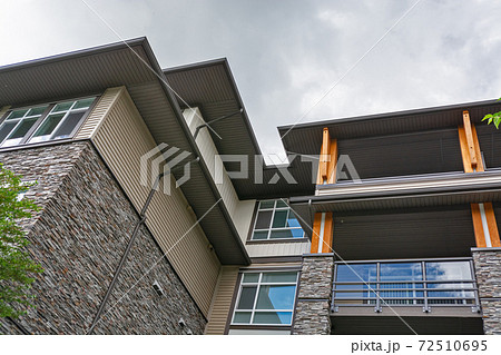 Residential building roof silhouette on overcast sky background Residential building roof silhouette on overcast sky background 72510695