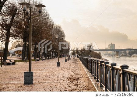 autumn embankment in city. walks by river. Cityscape. 72516060