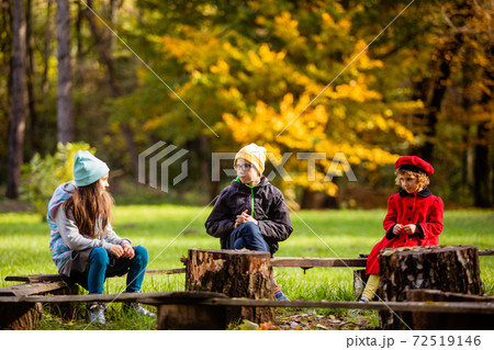 The children communicate at a distance outdoors during a pandemic The children communicate at a distance outdoors during a pandemic 72519146