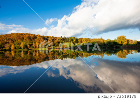 Fascinating autumn landscape with perfect water reflection 72519179