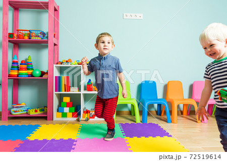 Two little friends have fun in the kindergarten Two little friends have fun in the kindergarten 72519614