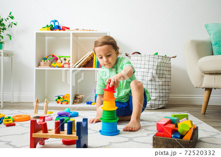 Child having good time at home or daycare. Child having good time at home or daycare. 72520332