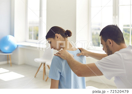 Professional osteopath during work with patient concept 72520479