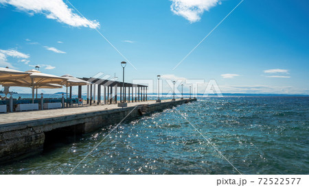 Pier with cafe in Nikiti, Greece Pier with cafe in Nikiti, Greece 72522577
