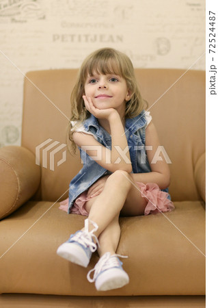 little blond baby girl sit on armchair smiling close up portrait on retro interior background little blond baby girl sit on armchair smiling close up portrait on retro interior background 72524487