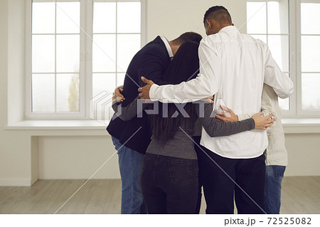 People embracing each other in corporate team building meeting or in group therapy session People embracing each other in corporate team building meeting or in group therapy session 72525082