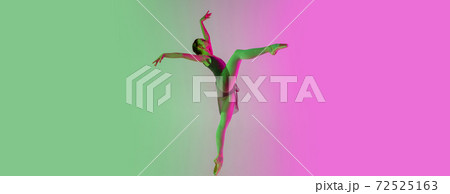 Young and graceful ballet dancer isolated on gradient pink-green studio background in neon light. Art in motion Young and graceful ballet dancer isolated on gradient pink-green studio background in neon light. Art in motion 72525163