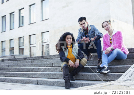 cute group of teenages at the building of university with books huggings, diversity nations real students lifestyle cute group of teenages at the building of university with books huggings, diversity nations real students lifestyle 72525582