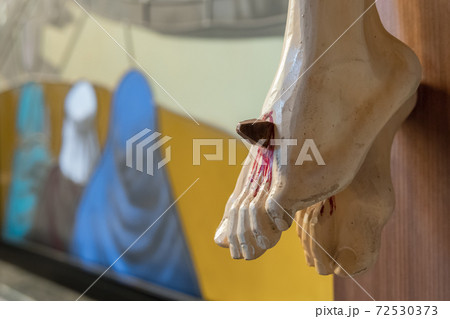 Nailed feet of Jesus Christ 72530373