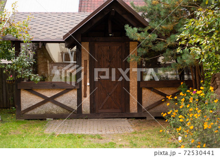 summer house on a green lawn among the trees summer house on a green lawn among the trees 72530441