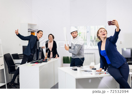 Celebrating success. Cheerful young people looking excited. Succ 72532094