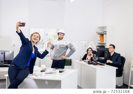 After hours in the office. Employees having fun after a hard wor 72532108