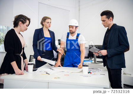 A Group Of Young Coworkers Making Great Business Decisions. Crea A Group Of Young Coworkers Making Great Business Decisions. Crea 72532316