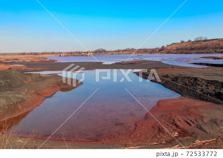 Technical settler of industrial water of mining industry in Kryvyi Rih, Ukraine. Red water polluted with iron ore waste Technical settler of industrial water of mining industry in Kryvyi Rih, Ukraine. Red water polluted with iron ore waste 72533772