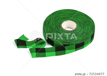 elastic knitted tape yarn for crochet on white background rolled up. 72534077