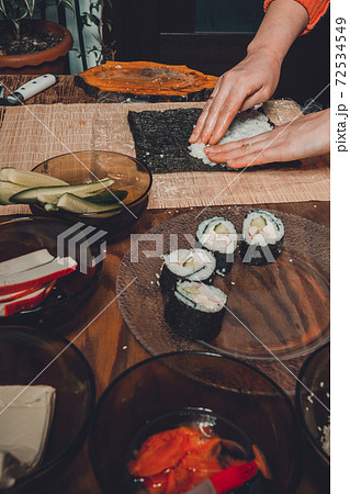 The process of making sushi from natural ingredients is a professional chef in the restaurant The process of making sushi from natural ingredients is a professional chef in the restaurant 72534549