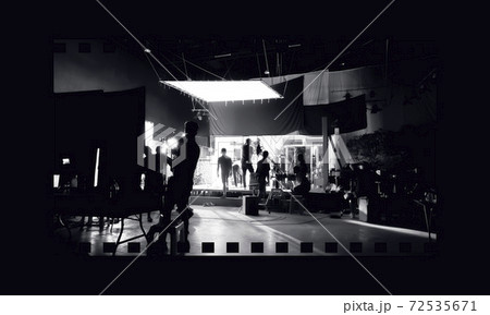 Silhouette images of video production behind the scenes or b-roll or making of TV commercial movies that film crew team lightman and videos cameraman working together with movie director in studio. Silhouette images of video production behind the scenes or b-roll or making of TV commercial movies that film crew team lightman and videos cameraman working together with movie director in studio. 72535671