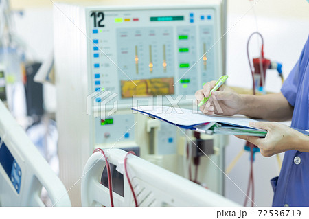 The specialist are checking continuous renal replacement therapy equipment and injection pump and hemodialysis machine. The specialist are checking continuous renal replacement therapy equipment and injection pump and hemodialysis machine. 72536719