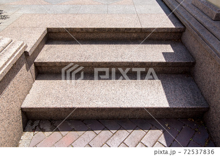 threshold with steps of marble and stone tiles, close up of the entrance lit by sunlight. threshold with steps of marble and stone tiles, close up of the entrance lit by sunlight. 72537836