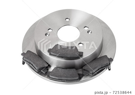 set of brake pads and brake disc new car spare parts brakes for a vehicle close up view isolated on a white background, nobody. set of brake pads and brake disc new car spare parts brakes for a vehicle close up view isolated on a white background, nobody. 72538644