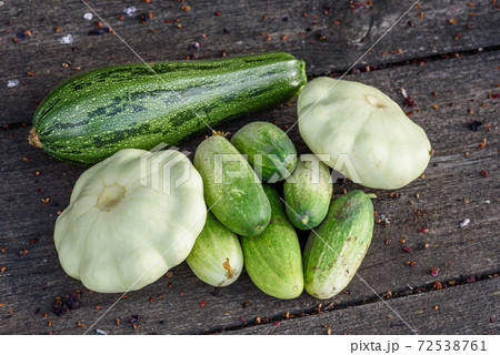 Zucchini, pattypan squash, cucumbers harvested from garden beds Zucchini, pattypan squash, cucumbers harvested from garden beds 72538761