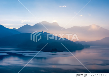 The Sunrise with Lalu Island, Cien Pagoda and Xuanguang Temple in Sun Moon Lake in Yuchi Township, Nantou County, Taiwan. 72543479