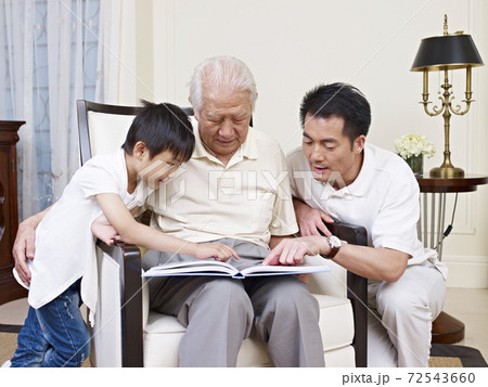 asian son, father and grandfather reading a book together asian son, father and grandfather reading a book together 72543660