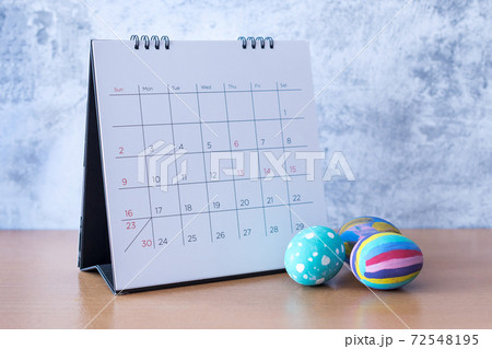 Happy Easter Calendar with an easter egg. Easter festive holidays concept. Happy Easter Calendar with an easter egg. Easter festive holidays concept. 72548195
