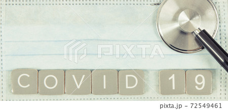 Inscription covid-19 with mask and stethoscope. Novel Chinese coronavirus. 2019-nCoV. Sars-CoV-2 72549461